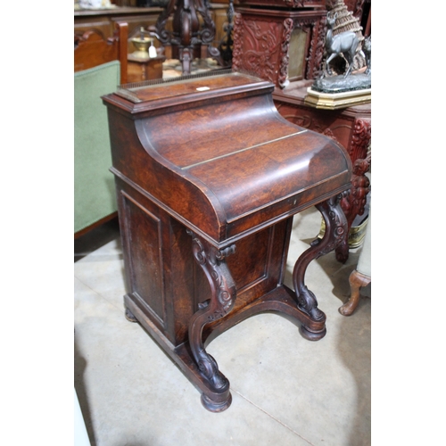 525 - Mid Victorian figred walnut piano top davenport, the curved front enclosing fitted interior and with... 