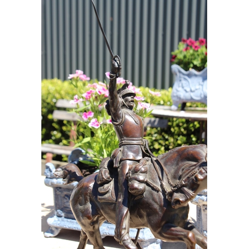 446 - Pierre Tougeneff (1854-1912) A charging cuirassier, signed, bronze sculpture, approx 54cm H x 38cm W