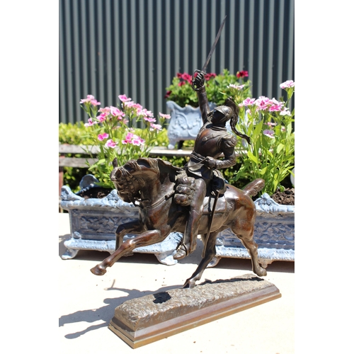 446 - Pierre Tougeneff (1854-1912) A charging cuirassier, signed, bronze sculpture, approx 54cm H x 38cm W