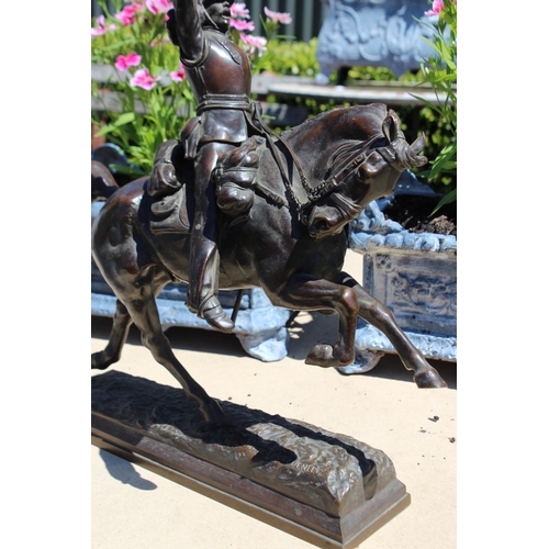 446 - Pierre Tougeneff (1854-1912) A charging cuirassier, signed, bronze sculpture, approx 54cm H x 38cm W