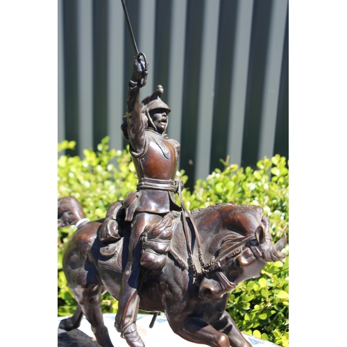 446 - Pierre Tougeneff (1854-1912) A charging cuirassier, signed, bronze sculpture, approx 54cm H x 38cm W