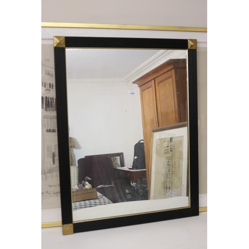 1106 - Modern ebonized and gilt corner wall mirror, approx 90 cm x 69.5 cm