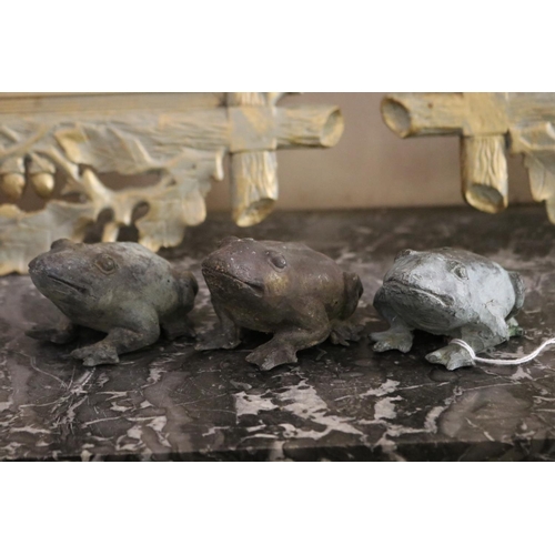 1112 - Three bronze frogs, approx 5cm H x 9cm L each (3)