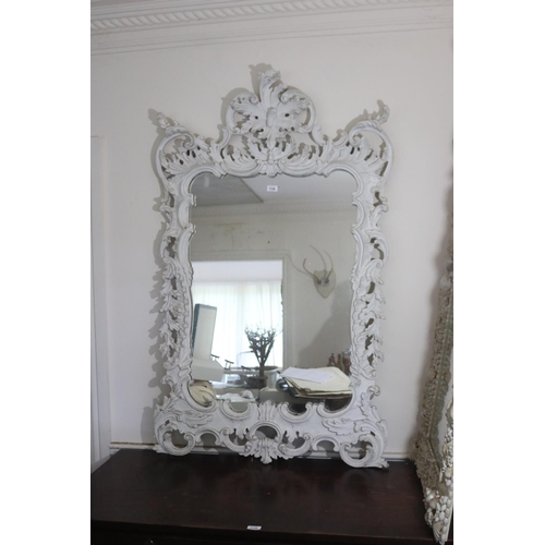 1128 - Antique style wall mirror, with C scrolls and foliage frame, approx 143cm H x 92cm W