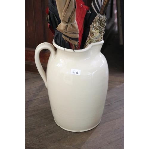 1144 - Large pottery glazed jug, applied lop handle, approx 41 cm high
