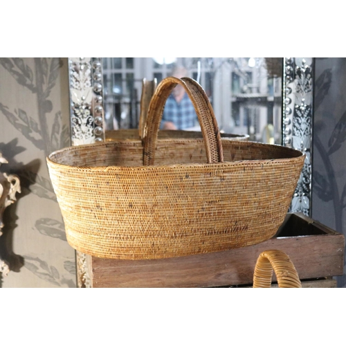 1167 - Three cane baskets, approx 18.5cm H x 54cm x 38cm ex handles and smaller (3)
