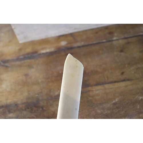 1201 - Antique ivory page turner with a sage, approx 25cm L