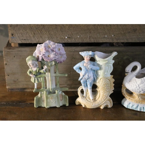 1202 - Four coloured bisque antique figures, approx 12cm H x 12cm W and smaller (4)