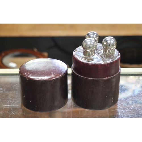 1345 - Antique red stained cylinder three bottle traveling set. A/f to one bottle, approx 14cm H x 9cm Dia