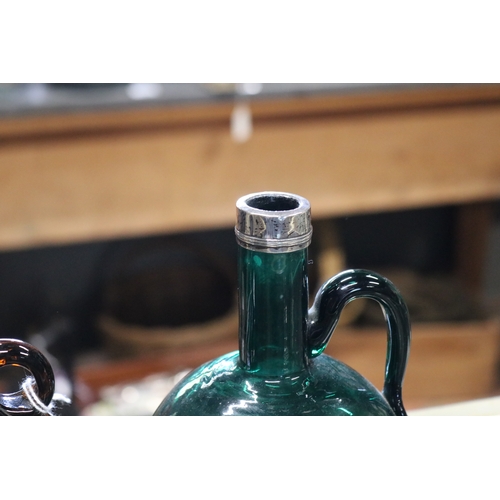 1346 - Three antique English Bristol coloured glass decanters. each with metal mounts, in green, brown, amb... 