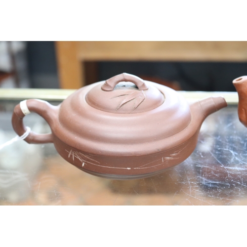 1355 - Two Chinese terracotta tea pots, approx 11cm H x 18cm W and shorter (2)