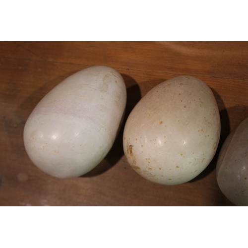 2585 - Three hardstone eggs, approx 13cm L and smaller (3)