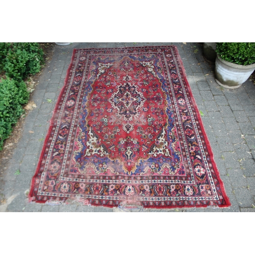 2587 - Distressed condition red ground carpet, approx 322cm L x 211cm W