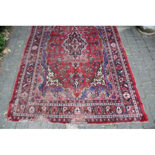 2587 - Distressed condition red ground carpet, approx 322cm L x 211cm W