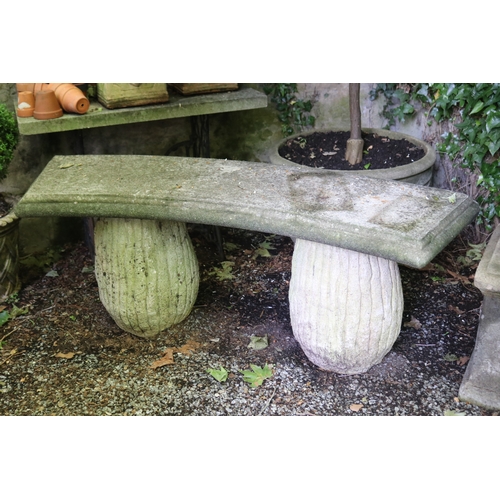 2027 - Old curved stone bench top on pair of fluted supports, approx 59cm H and 130cm W