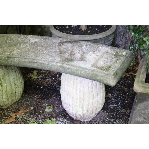 2027 - Old curved stone bench top on pair of fluted supports, approx 59cm H and 130cm W