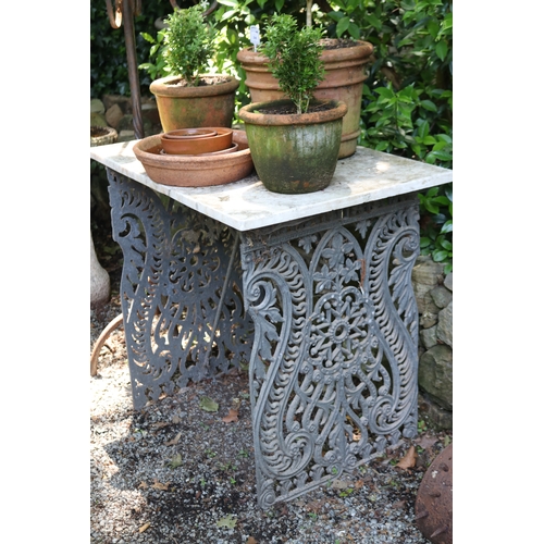 2047 - Marble topped cast metal support garden table, approx 81cm H x 89cm W x 60cm D