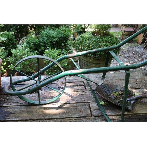2057 - Metal wheel barrow frame, old shovel head, and antique cast iron meter cover, 141cm L and smaller