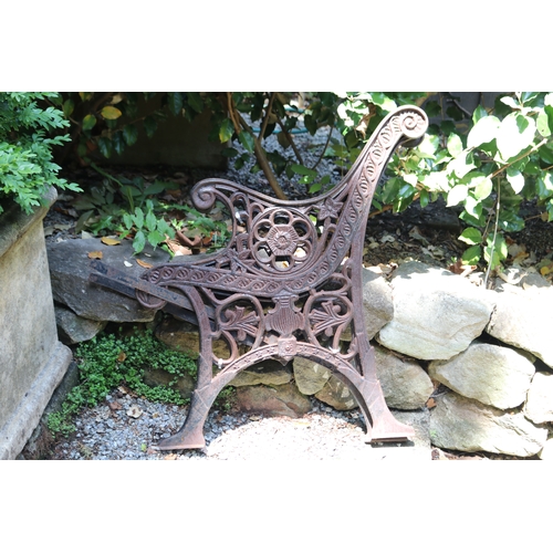 2085 - Pair of cast iron bench ends, approx 65cm W (2)