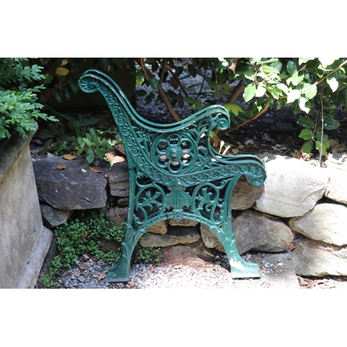2086 - Pair of green painted cast iron bench ends, approx 67cm W (2)