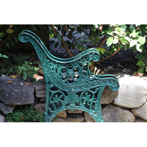 2086 - Pair of green painted cast iron bench ends, approx 67cm W (2)