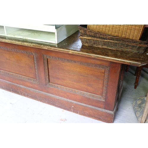 2591 - Antique silky oak and pine long shop counter, four recessed panel front, approx 85cm H x 374cm L x 7... 