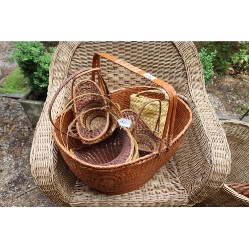 2598 - Cane arm chair, baskets, numerous small cane baskets