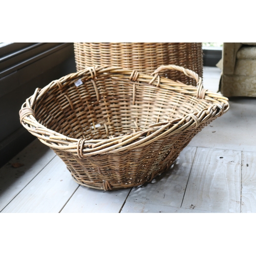 2599 - Large cylinder cane basket with twin handles, along with an oval basket, approx 63cm H ex handles x ... 