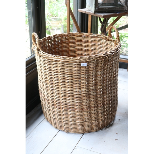 2599 - Large cylinder cane basket with twin handles, along with an oval basket, approx 63cm H ex handles x ... 