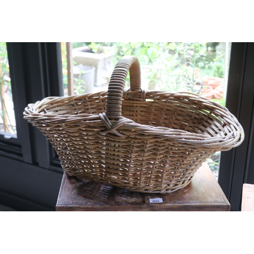 2602 - Large cane basket with central hoop handle, approx 25cm ex handle x 72cm W x 44cm D