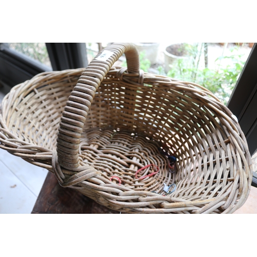 2602 - Large cane basket with central hoop handle, approx 25cm ex handle x 72cm W x 44cm D