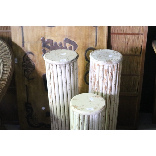 2637 - Three distressed painted circular pedestals, approx 84cm H and shorter (3)