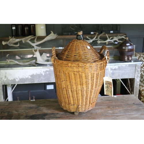 2672 - Large cane covered glass wine bottle, approx 62cm H x 42cm Dia