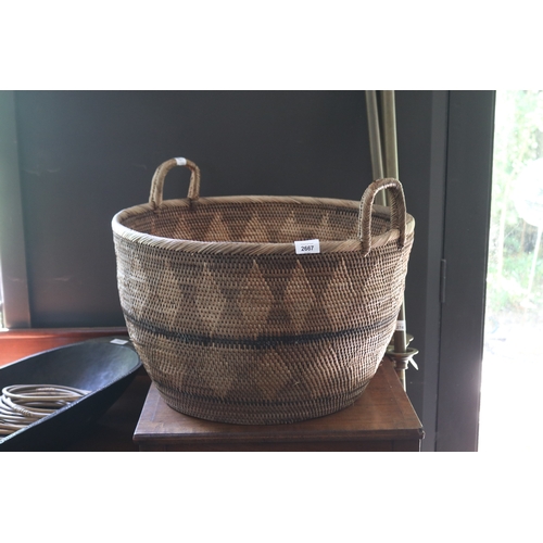 2667 - Good native hand woven twin handled basket, approx 34cm H ex handles x 54cm Dia