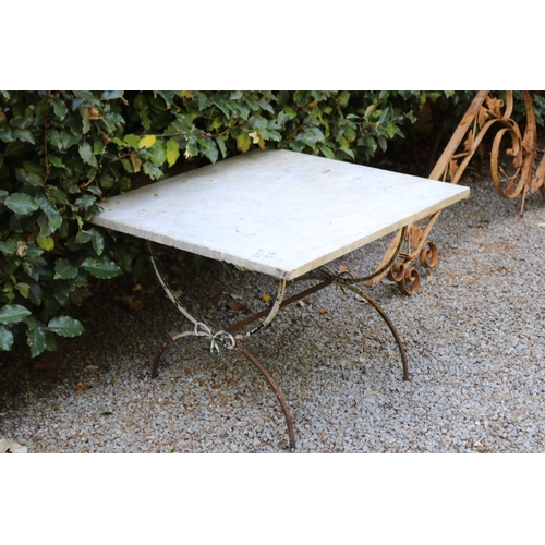 2751 - Marble topped X frame iron based garden table, approx 71cm D x 76cm W x 54cm H