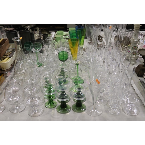 2278 - Assortment of various glassware to include champagnes and wines etc, some etched and some coloured, ... 