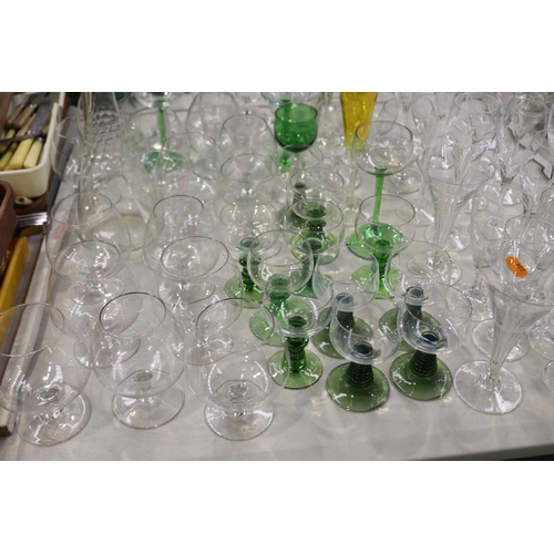 2278 - Assortment of various glassware to include champagnes and wines etc, some etched and some coloured, ... 