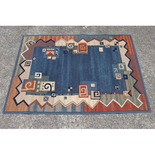 2344 - Handwoven blue ground carpet, approx 171cm x 231cm