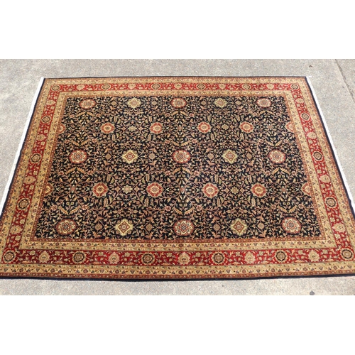 2348 - Fine hand knotted wool Persian carpet, with central royal blue field with all over flower heads and ... 