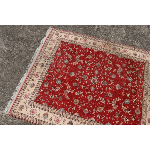 2349 - Fine quality Iranian rug - wool and silk hand knotted carpet, central red field with ivory border, a... 