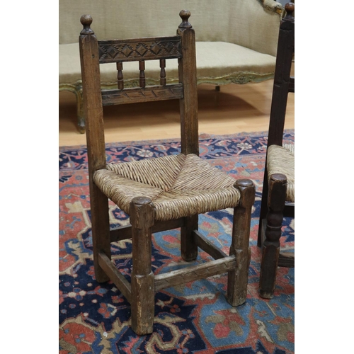 2403 - Two similar antique late 17th century or early 18th century Spanish rush seated chairs, each approx ... 