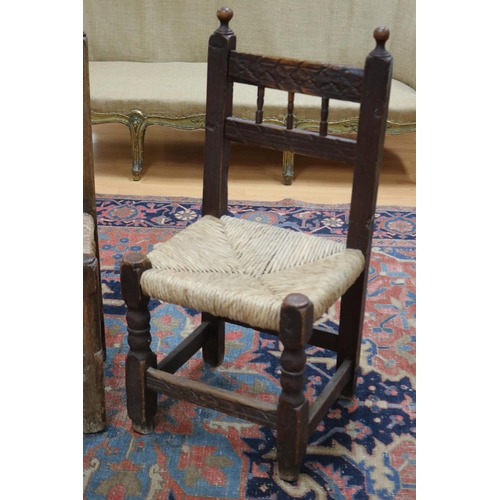 2403 - Two similar antique late 17th century or early 18th century Spanish rush seated chairs, each approx ... 