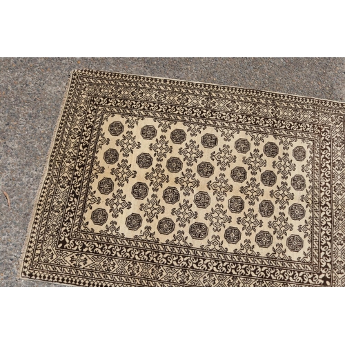 2083 - Persian Bukhara carpet, approx 146cm x 105cm