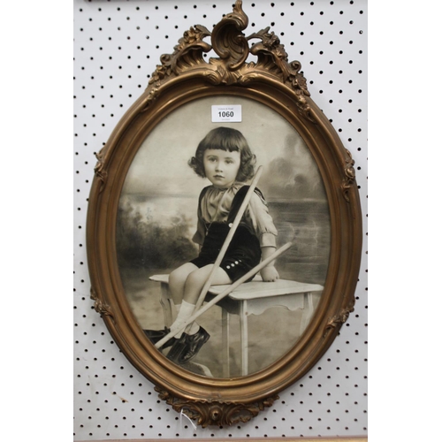 1060 - Antique French photograph of Little girl in gilt gesso oval frame, approx 38cm x 28cm