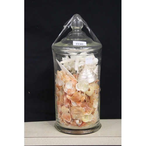 2240 - Decorative lidded glass jar with shells, approx 35cm H