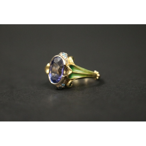 2422 - 18ct gold antique style enamelled dress ring set with an oval cut tanzanite approx 2 carats, in orig... 