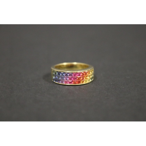2424 - 18ct yellow gold ring set with Parti coloured sapphires in a rainbow pattern, in original box. Purch... 