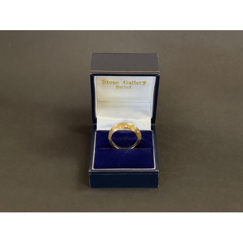 2425 - 18ct yellow gold modern knife edge design ring set with 10 small diamonds, in original box. English ... 