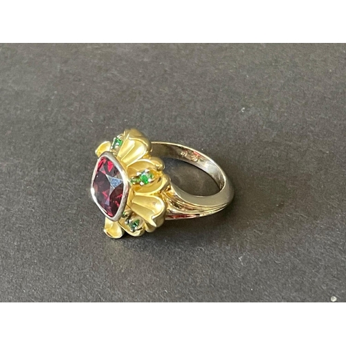 2426 - 9ct and 18ct yellow and white gold flower design dress ring set with a large centre red stone and fo... 