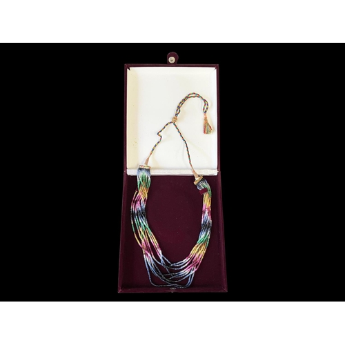 2430 - Contemporary Eastern necklace, 9 strands of semi precious multi stones that make an IKAT design, on ... 